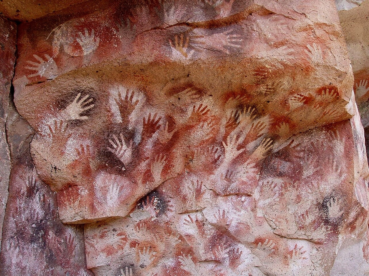 Cave painting of hands from Cueva de las Manos, Santa Cruz, Argentina. via https://en.wikipedia.org/wiki/Cueva_de_las_Manos